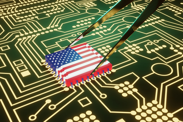 A microchip in third dimension designed to look like an American flag being placed on a circuit board using tweezers.