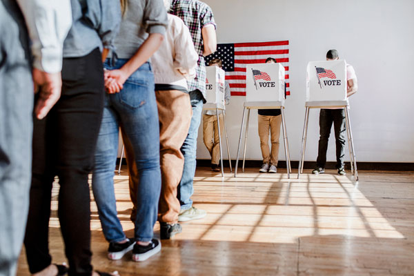 Voters standing in line getting ready to cast their votes.