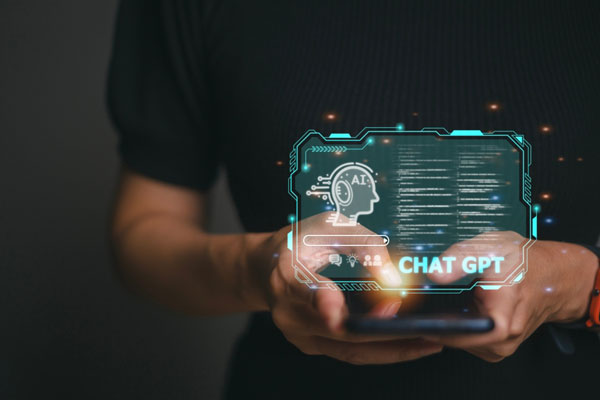  A close-up photo of a person's hands holding a virtual screen of chat gpt.